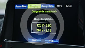 Electric car dashboard display. Electric car charging indicating the progress of the charging, electric vehicle battery