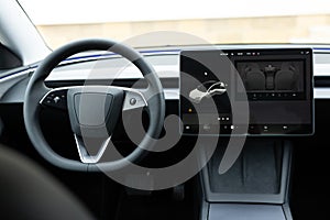 Electric car interior luxury. Interior of prestige modern car. Leather comfortable seats, dashboard and steering wheel