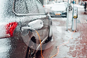 Electric car plug charging in the winter