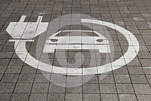 Electric car sign on road. Pictogram at the parking place. Car charging icon