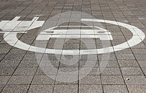 Electric car sign on road. Pictogram at the parking place. Car charging icon