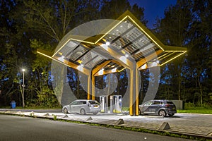 Electric cars charging station at night