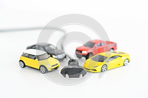 Electric cars concept with many toys vehicles on white background