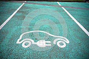 Electric charging point sign on asphalt for vehicle car or bike free no charge in car parking space