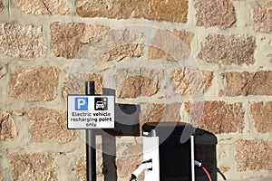 Electric charging point for vehicles cars bikes free no charge operated in shopping mall retail park in car parking space