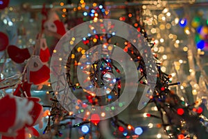 Electric Christmas lights as object in supermarket, shop for sale. A wide range, a variety of colorful Decorative garland.