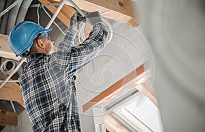 Electric Contractor Worker Installing Ceiling Light Point