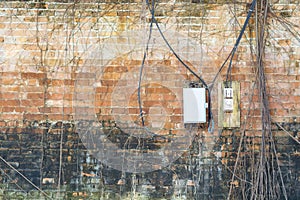 Electric control box on the old brick wall