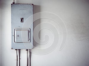 Electric control panel is installed on the old wall.