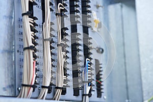 Electric control panel. The wires are connected to residual current circuit breakers and voltage monitoring relays.