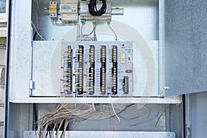 Electric control panel. The wires are connected to residual current circuit breakers and voltage monitoring relays.