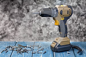 Electric Cordless Brushless Screwdriver for Construction Work on Wooden Table