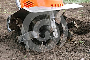 Electric cultivator for cultivating soil