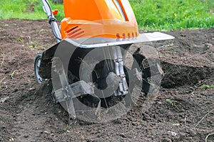 Electric cultivator for cultivating soil in vegetable garden