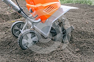 Electric cultivator for cultivating soil in vegetable garden
