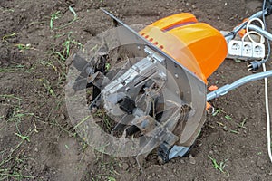 Electric cultivator for cultivating soil in vegetable gardens