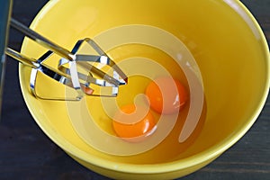 Electric Egg Beater in a Mixing Bowl of Egg Yolk for COOKING AT HOME