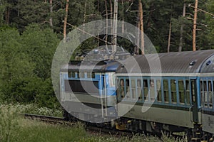 Electric engine and blue coach from window