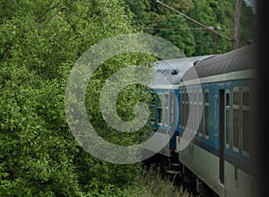 Electric engine and blue coach from window