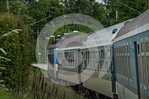 Electric engine and blue coach from window