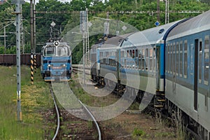 Electric engine and blue coach from window