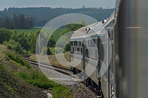 Electric engine and blue coach from window