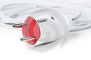 Electric European plug. White power cable with plug. Power cord close-up