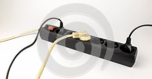 Electric extension cord with 220 V sockets. Extension cord for sockets. The concept of electricity consumption.