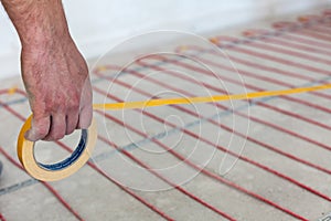 Electric floor heating system installation in new house