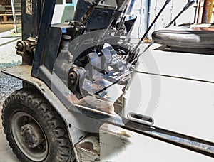 Electric forklift in warehouse from the inside, pedals