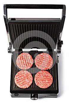 Electric grill and raw burger meat