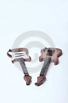 Electric guitar and acoustic bass  on white background
