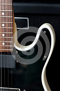 Electric guitar on the background of the guitar amplifier.