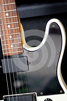 Electric guitar on the background of the guitar amplifier.