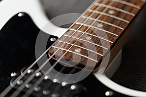 Electric guitar black and white color, detail. Music instruments. Concept international music day