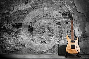 Electric guitar on a brick wall background