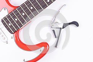 Electric Guitar with Capodastro isolated above white background