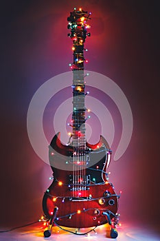 Electric guitar with Christmas garland lights