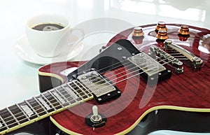 Electric guitar and  a cup of coffee