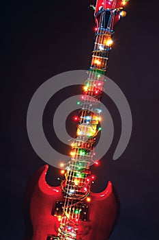 Electric guitar with festive Christmas lights