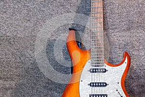 Electric guitar on the gray background