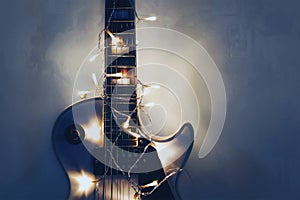 Electric guitar with lighted garland