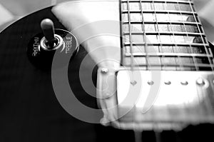 Electric guitar macro abstract black and white, zoom blur