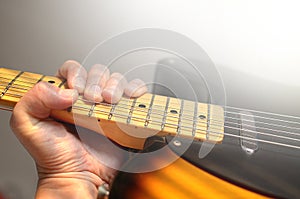 Electric guitar macro abstract, hand playing guitar