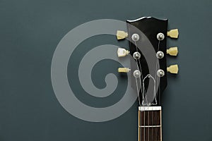 Electric guitar neck on dark background photo