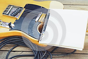 Electric guitar with notepad