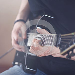 Electric guitar player, repetition of rock music band