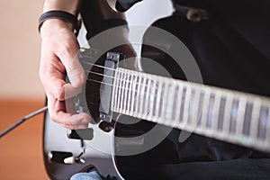 Electric guitar player, repetition of rock music band