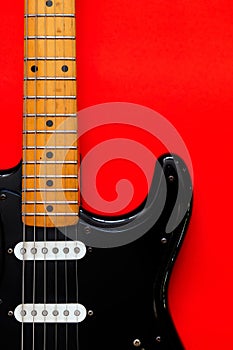 Electric Guitar on a red background.