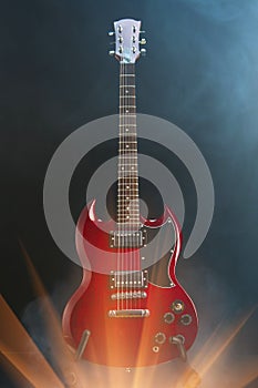 Electric guitar in smoke with shiny glare